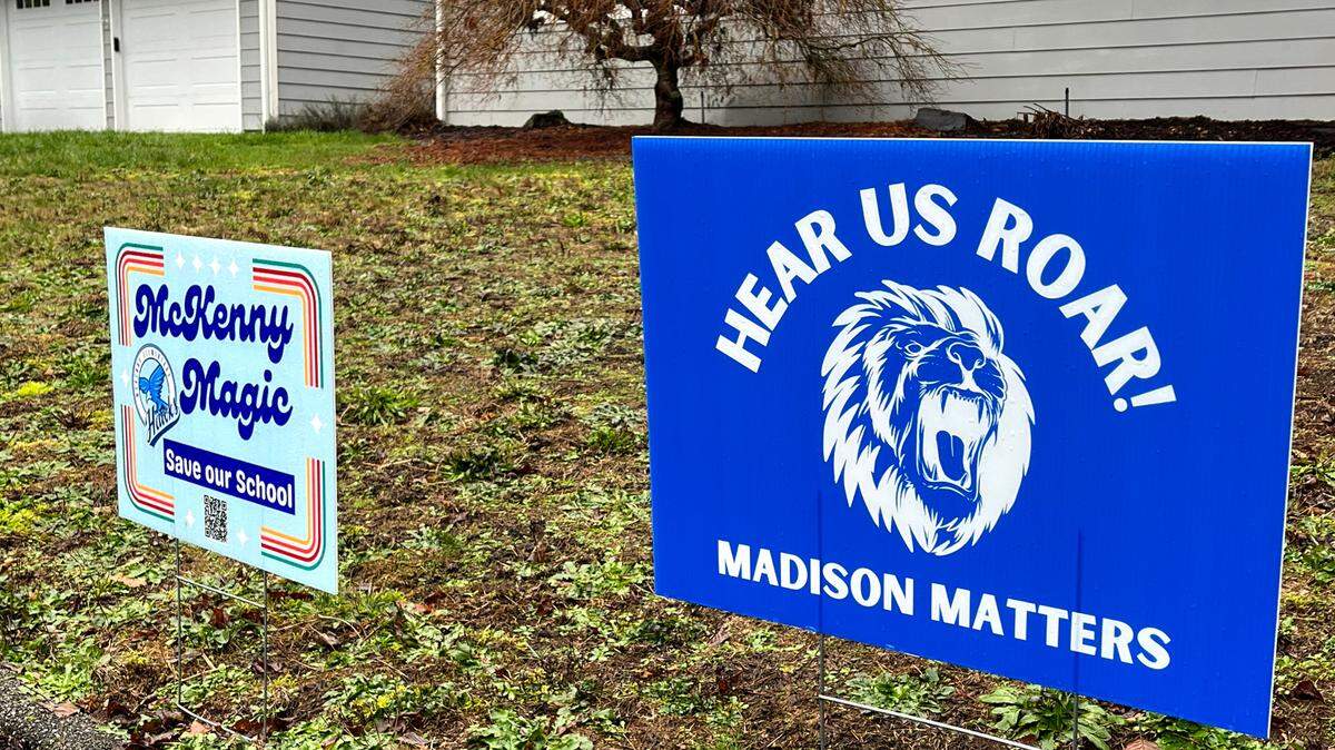 Signs of support for two Olympia elementary schools that sit directly in that district’s closure crosshairs are prominently displayed along the busy Wilderness Dr. SE arterial on Jan. 19, 2024. 