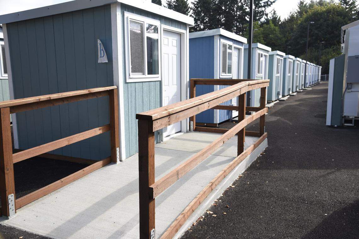 A row of tiny homes in the newly-opened tiny home village off of Franz Anderson Road in Olympia on Sept. 8, 2023. Residents began moving in this week from Wheeler Road as part of an initiative to move people out of right of ways in Washington state. The village can hold up to 50 people at a time.