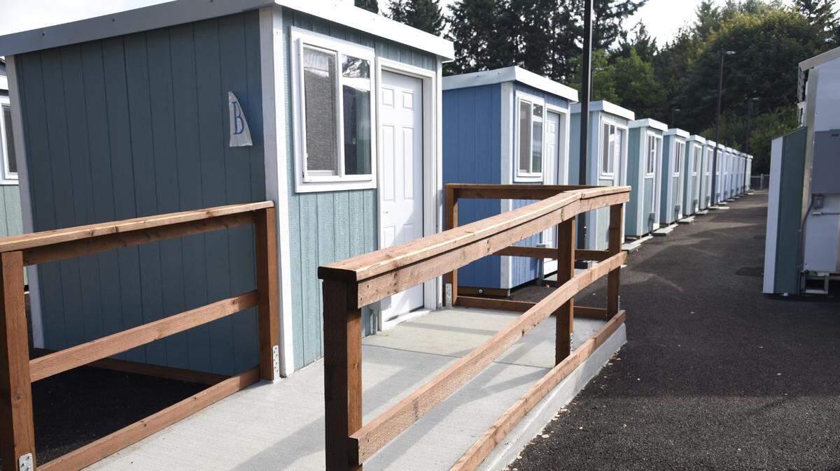 A row of tiny homes in the newly opened tiny home village off of Franz Anderson Road in Olympia. Residents began moving in last week from the Wheeler Road encampment as part of an initiative to move people out of right of ways in Washington state. The village can hold up to 50 people.