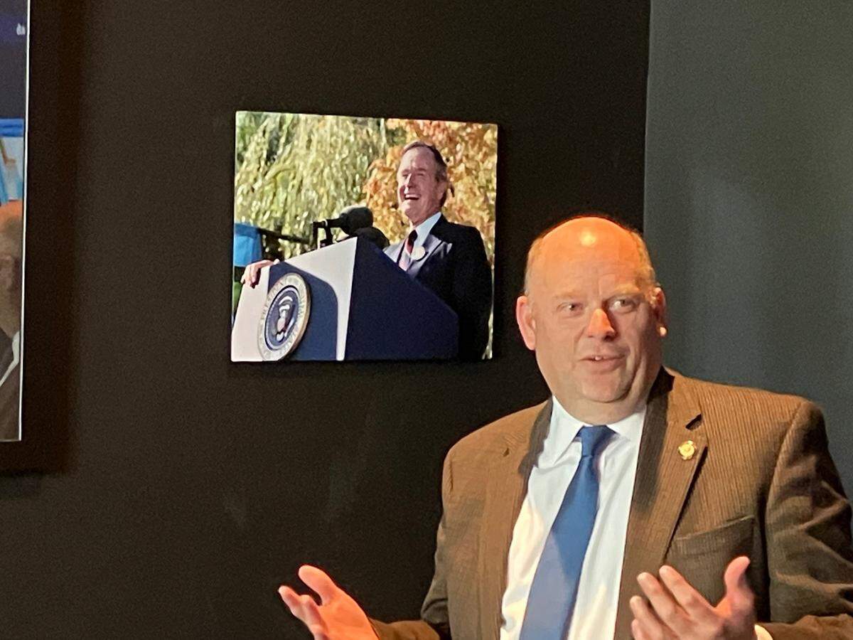 State Sen. Drew MacEwen shares a few thoughts about President George H.W. Bush and a photo of the president that now hangs on the wall of the President’s room at 1889 Prime Steakhouse.