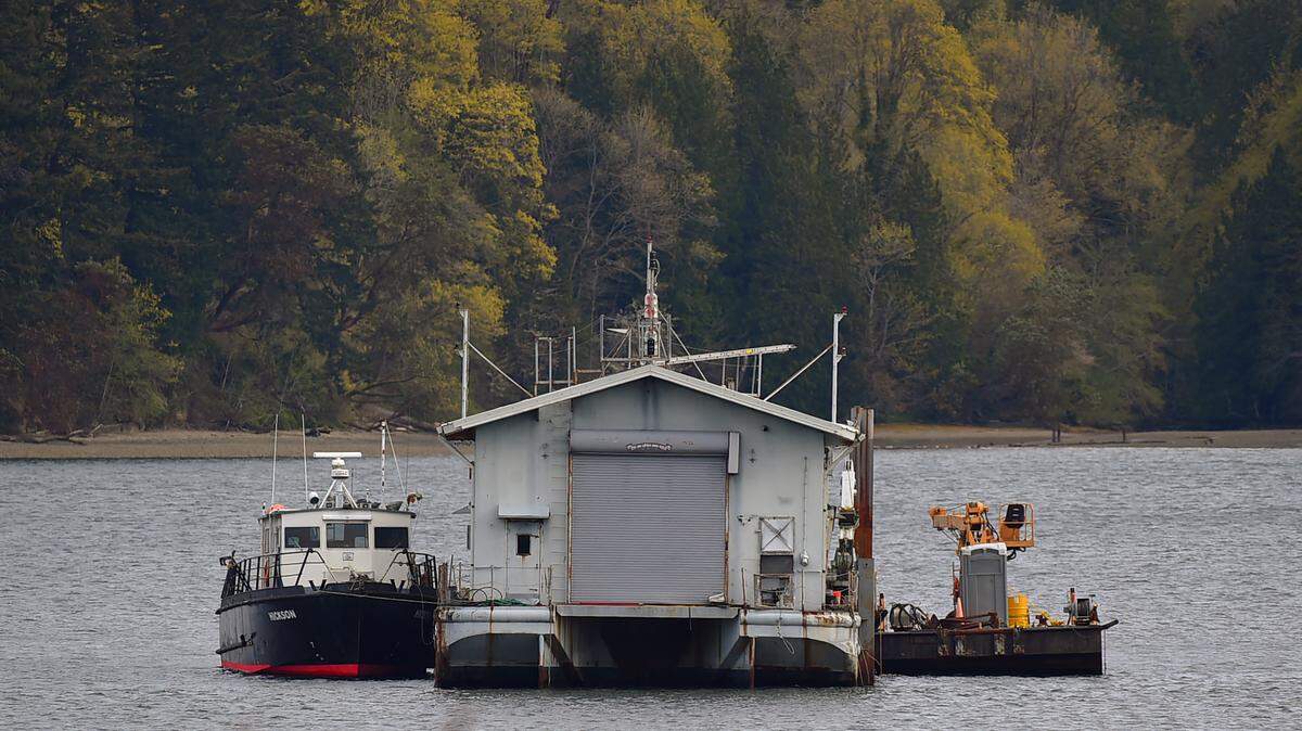 A former Navy barge now used for commercial diving has caught the attention of area residents who live near Budd Inlet’s West Bay.