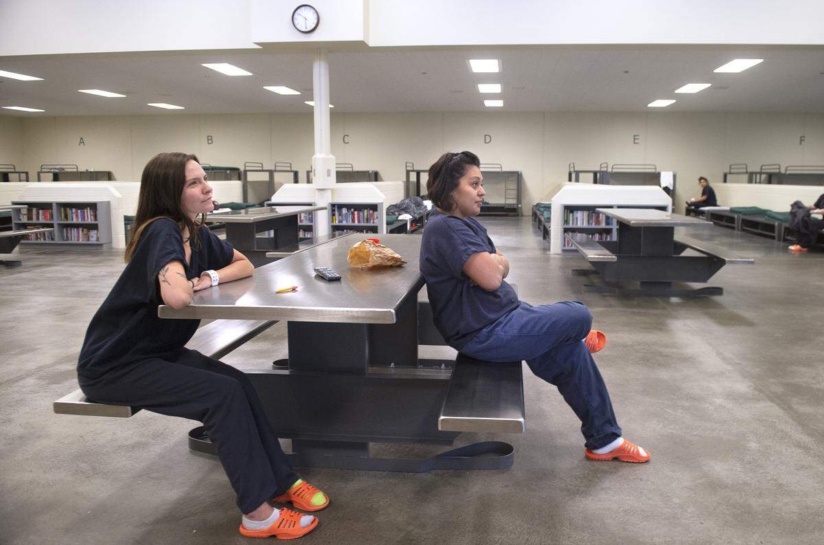Abbi Scott (left) and Jessica Oleachea relax in the women’s dormitory cellblock at the Thurston County Corrections Facility in Tumwater on Thursday, Sept. 12, 2019. The added freedom of the dorm comes with responsibilities like making your bed and keeping emotions in check. “It’s a correction facility used in the right manner,” Oleachea said. “...as opposed to a jail, stuck in a room, solitary confinement.”