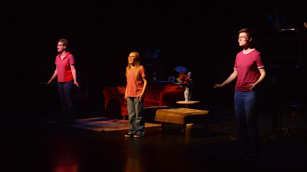The three Allisons unite on stage for the finale of SPSCC’s “Fun Home”: from left, Medium Allison played by Josie DeRosier, Small Allison played by Lola May Havens, and Allison (grown up) played by Heather Matthews.