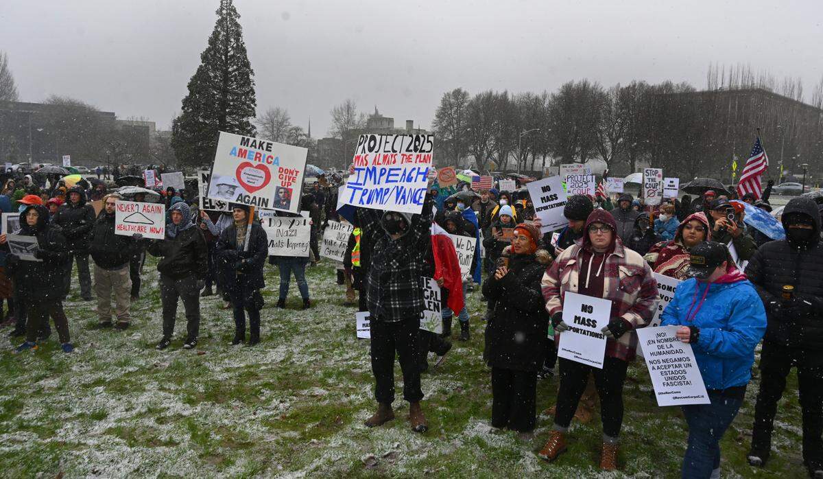 Hundreds of protesters coming from all walks of life assembled in a steady snowfall for a noon rally at the Capitol in Olympia, Wa. in opposition to President Donald Trump’s Project 2025 agenda and specifically, Elon Musk.