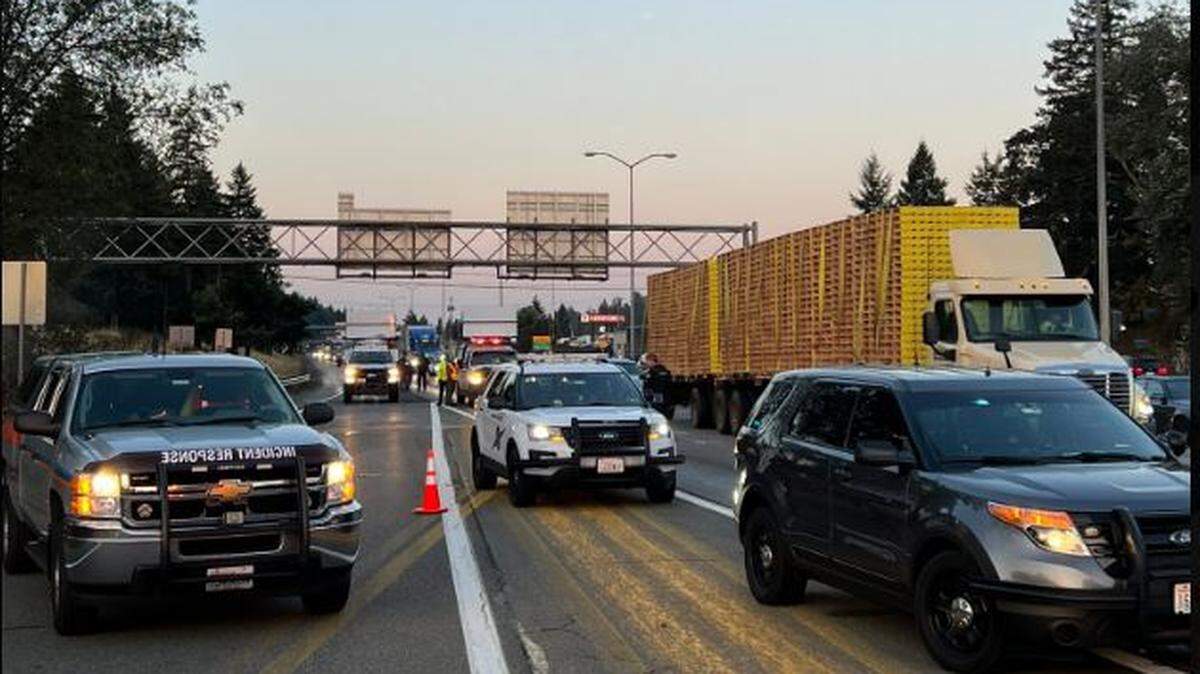 The two men were among eight people riding in a van when a loose wheel struck their vehicle on I-5 near Lakewood, according to Washington State Patrol.