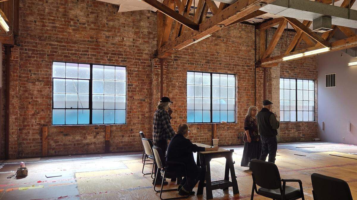 Theater Artists Olympia rehearses a show in its new space, still to be transformed from a dance studio to a theater. From left are Marko Bujeaud, George Dougherty, Pug Bujeaud and John Serembe.