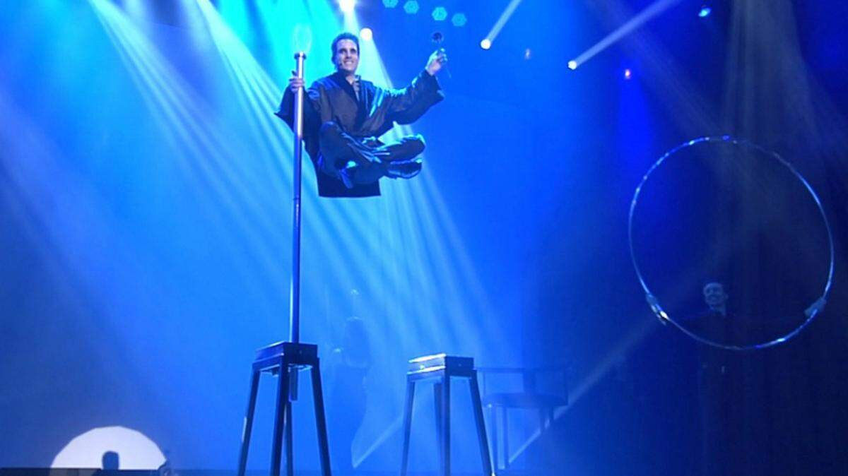 Michael Grandinetti performs his renowned levitation illusion live on stage.