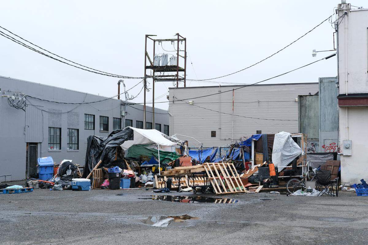 The remains of an improvised encampment damaged by fire in downtown Olympia on Wednesday, Feb. 2, 2022. Olympia firefighters responded to the fire at 12:36 p.m. and extinguished it in about 15 minutes, Olympia Fire Department Battalion Chief J.D. Young said.
