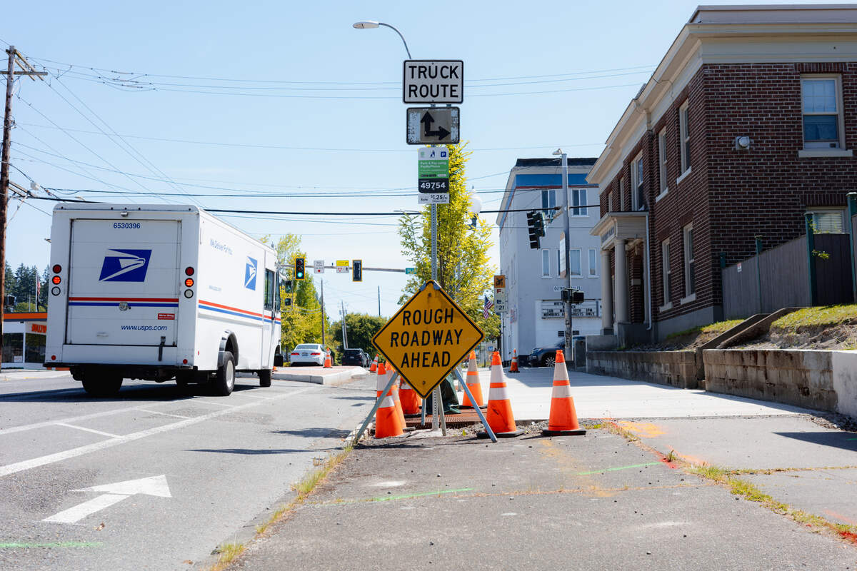 The city of Olympia is spending $1.6 million to improve pedestrian and bicycle safety at the intersection of Fourth Avenue and Plum Street in downtown. A sign warned of a rough road at the intersection amid in-progress improvements on Thursday, May 28, 2026.