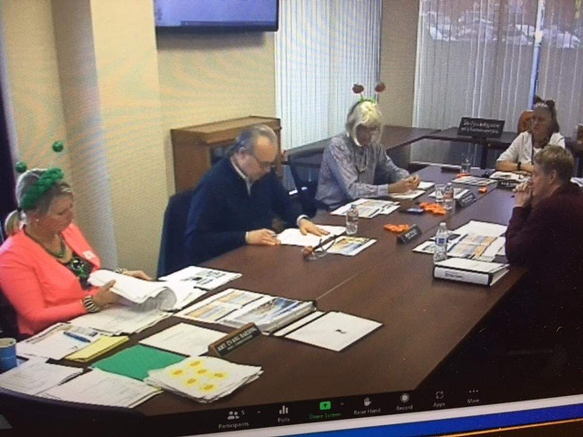 News of the federal grant was shared with the Port of Olympia commission during a special commission work session on Monday. Commissioners Amy Evans Harding and Joe Downing, wearing a wig, came dressed for Halloween.