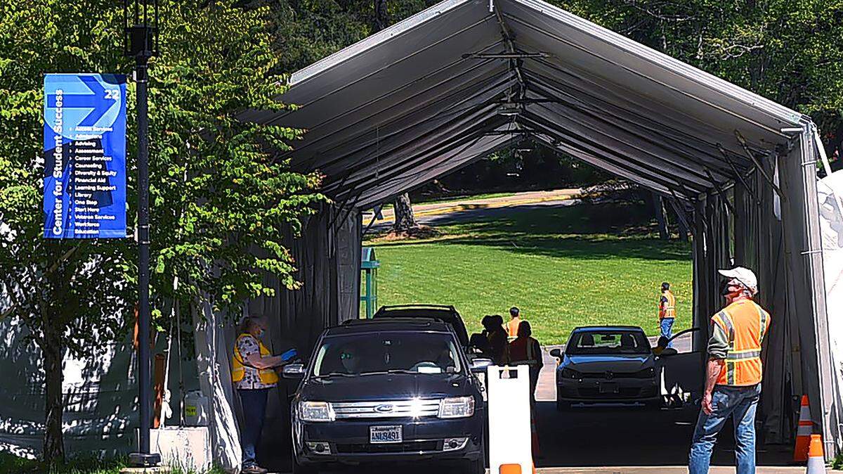 The South Puget Sound Community College campus in Olympia was empty Tuesday except for the vaccination drive through, after a former student sent threatening emails to staff and faculty. The campus will remain closed through Monday, and Thurston County Public Health and Social Services is relocating its mass vaccination events to the Thurston County Fairgrounds in Lacey.