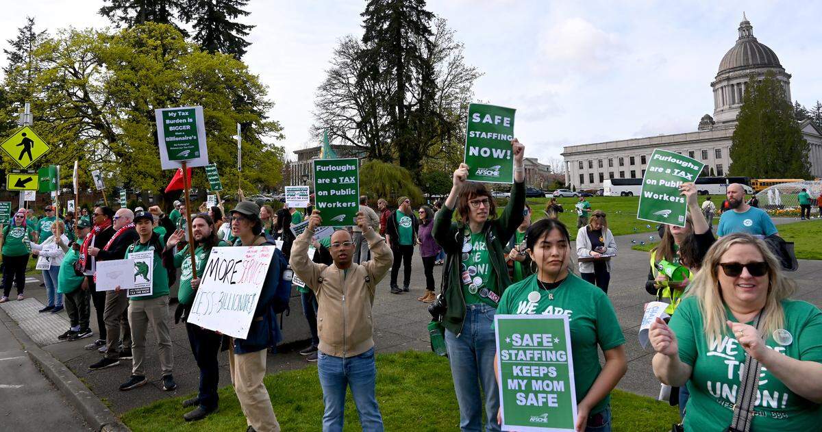 Dozens of members with the Washington Federation of State Employees gathered at the Tivoli Fountain on the Capitol campus in Olympia, Wa. for a rally and march in opposition to potential cuts and furloughs being proposed during the 2025 legislative session.