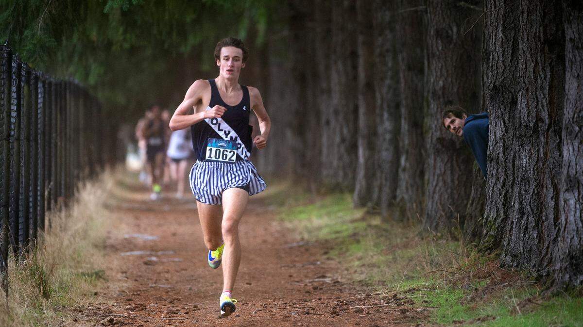 Olympia’s Ethan Coleman runs to victory in the boys elite 5K race during the Bill Kehoe South Sound Invite cross country meet at Saint Martin’s University in Lacey, Washington, on Oct. 9, 2021.
