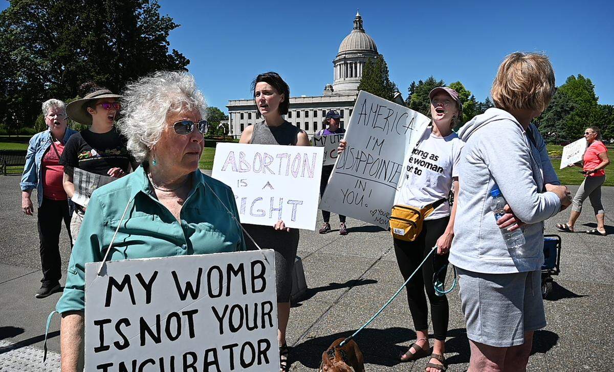 Dr. Kathleen O’Shaunessy of Olympia joins a few dozen supporters of women’s rights as they rally on the Capitol Campus in Olympia, Washington on Friday, June 24, 2022, following the morning’s announcement of the U.S. Supreme Court’s overturning of Roe v Wade.