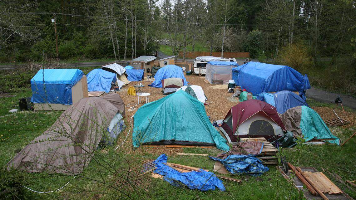 Before Quixote Village was a permanent tiny home settlement, it was a nomadic homeless camp. Here's Camp Quixote at the  Universalist Unitarian Church property on Division Street in west Olympia in 2008.