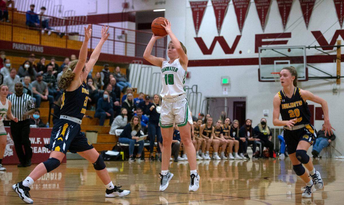 Tumwater’s Aly Waltermeyer puts up a jumper between Burlington-Edison defenders Amey Rainaud (left) and Sydney Reisner during Saturday night’s 2A girls basketball state tournament regional-round game at WF West High School in Chehalis, Washington, on Feb. 26, 2022. Burlington-Edison won the game, 52-47.