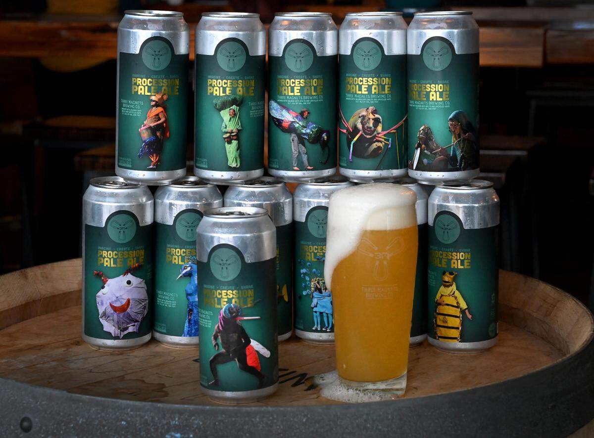 Three Magnets Brewing Co. of Olympia is releasing a limited run of a hazy IPA to commemorate the Procession of the Species, which won’t happen this year. The pale ale will raise funds for Earthbound Productions, which produces the Procession, in hopes that the huge community event can return in 2023. Photos of critters and plant life that have appeared in past Processions are featured on the cans.