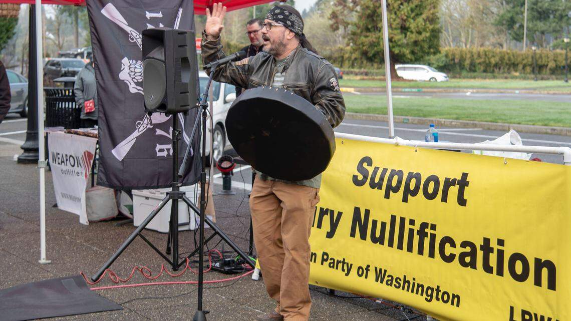 Ben “Chief” Charles speaks to a crowd of gun rights’ demonstrators at the Washington State Capitol on Thursday, Feb. 10. Charles told McClatchy Thursday that he feels “disappointed” in the gun legislation that passed on Wednesday evening. 