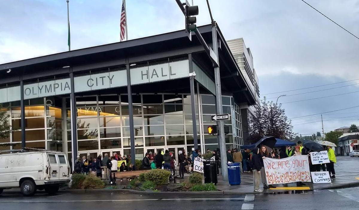 People gather outside Olympia City Hall on Tuesday.