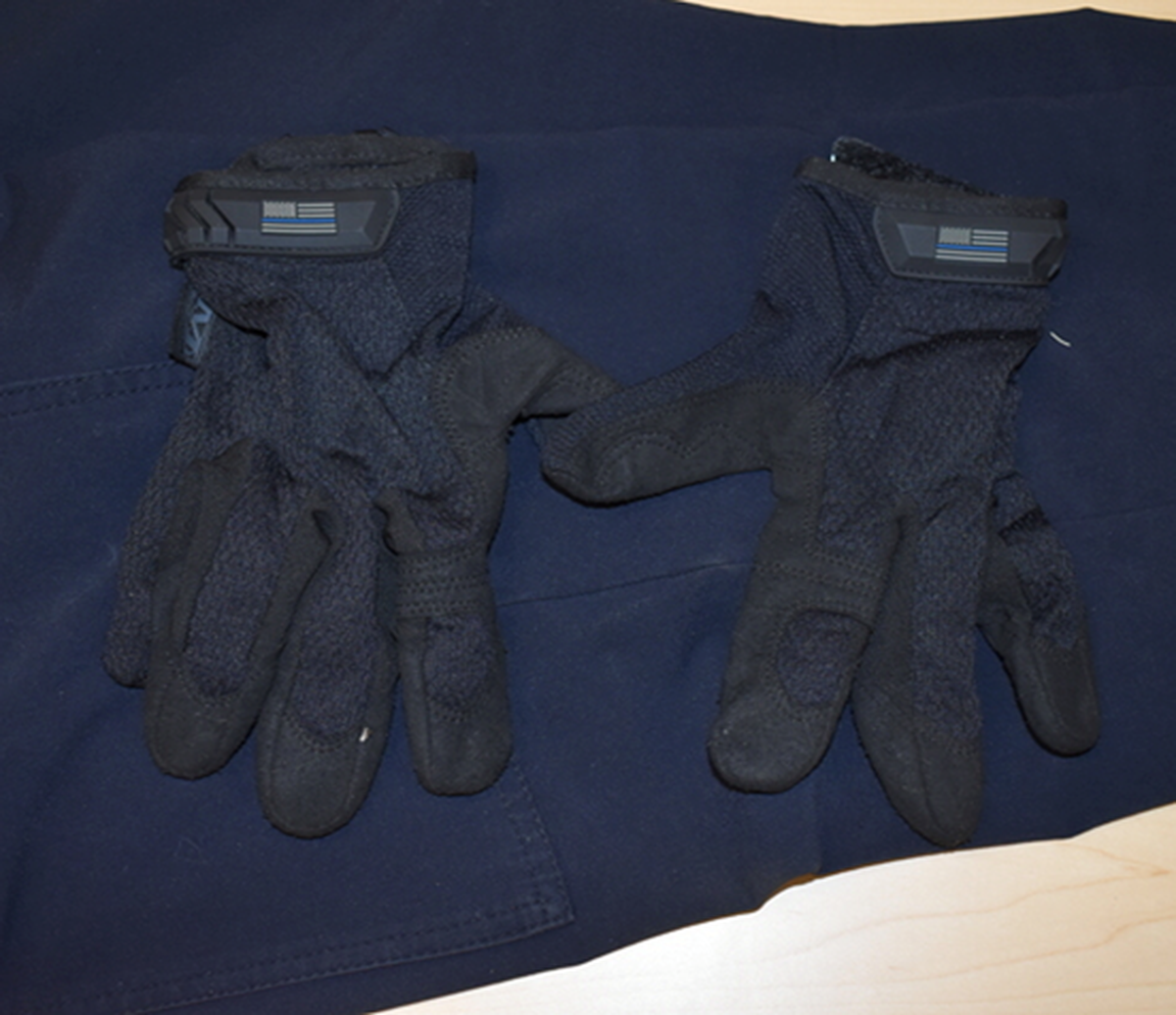 Olympia officer Jordan Anderson allegedly wore gloves with the “Blue Lives Matter” flag on them the day Timothy Green was shot and killed Aug. 22, 2022.