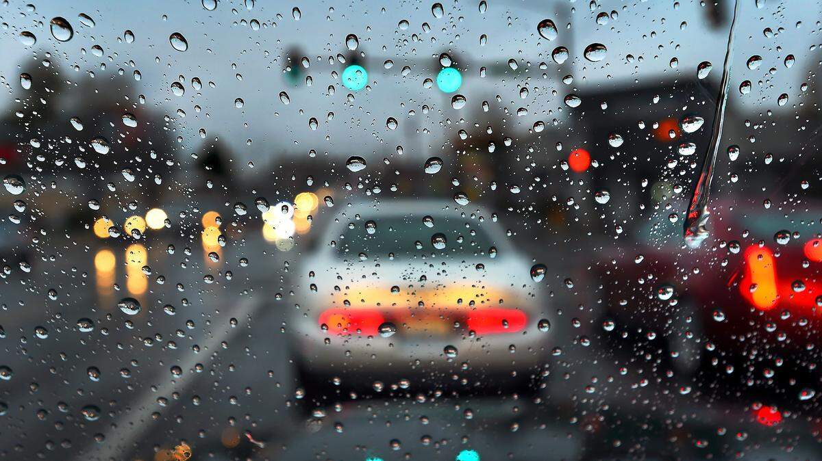 Motorists along Harrison Ave. NW in west Olympia slog through a steady downpour.