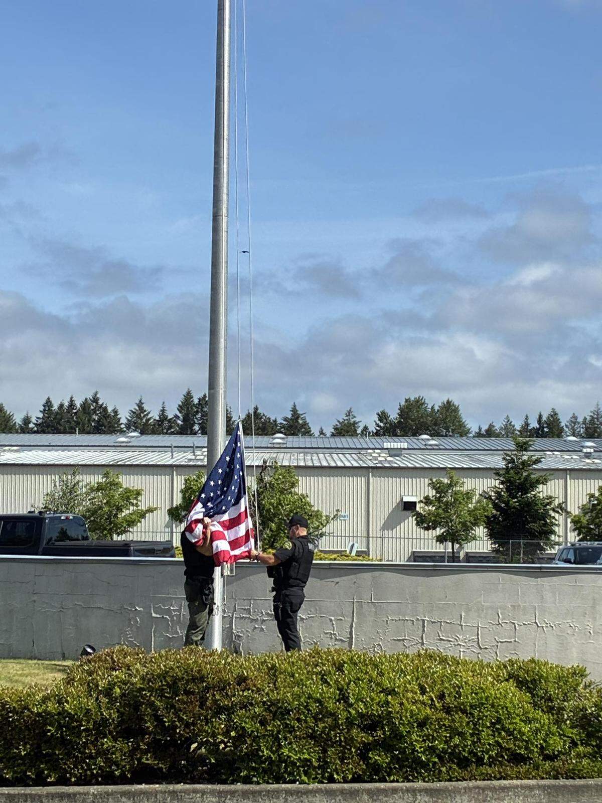 During the investigation into a man damaging a building, Thurston County Sheriff’s deputies also found a U.S. flag in a mailbox and reattached it to the flagpole.