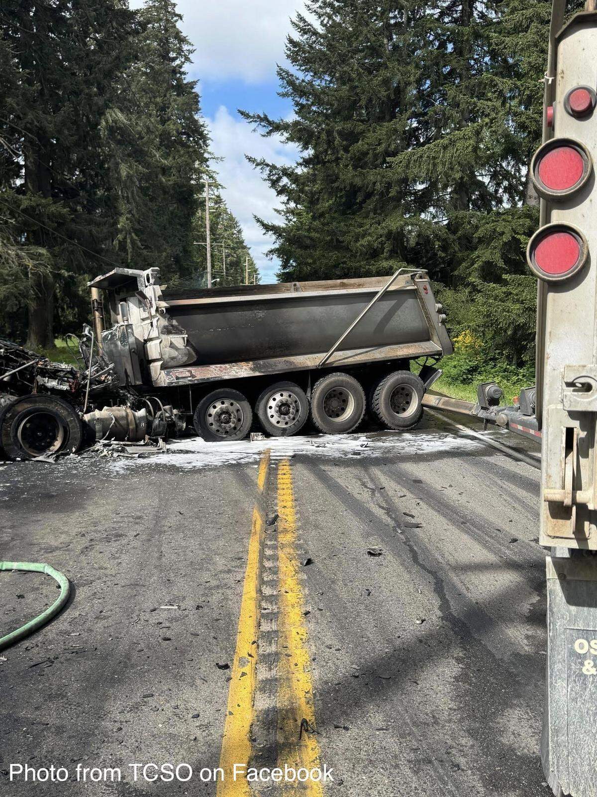 A dump truck is shown blocking Old Highway 99 in south Thurston County Monday morning.