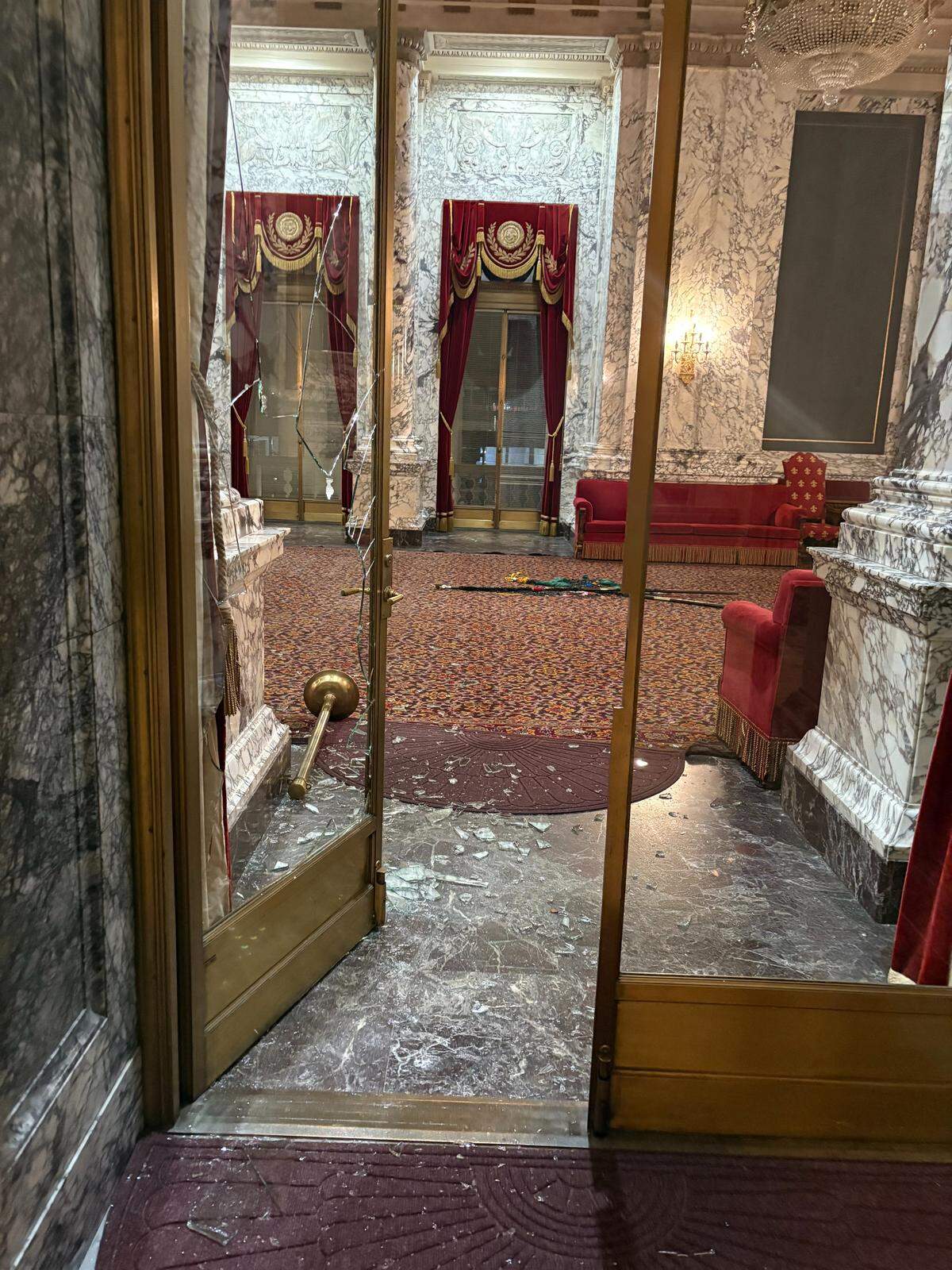 A glass door leading to the State Reception Room was shattered by an intruder who broke into the state Capitol building on Oct. 5, 2025.