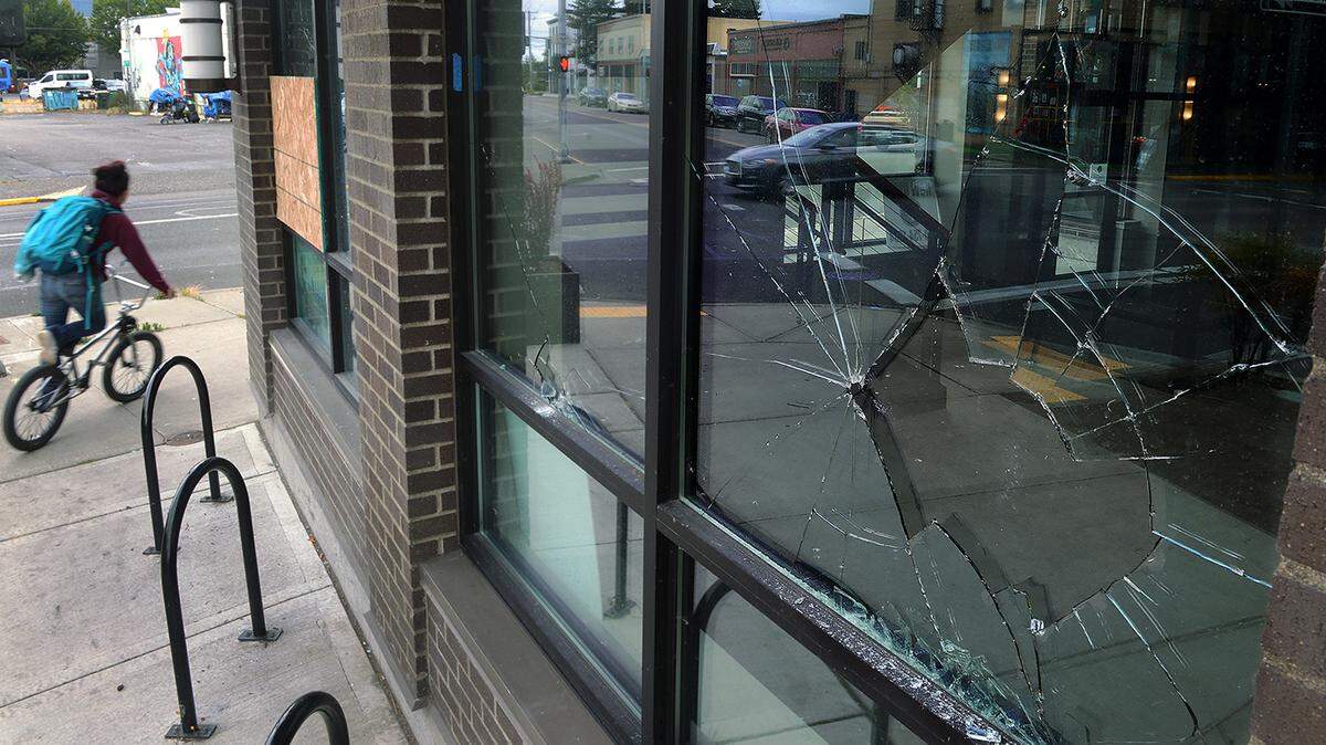 Broken windows seen July 7, 2020, at the 123 4th apartment building in downtown Olympia are visual remnants from a rolling overnight disturbance, according to Olympia police.