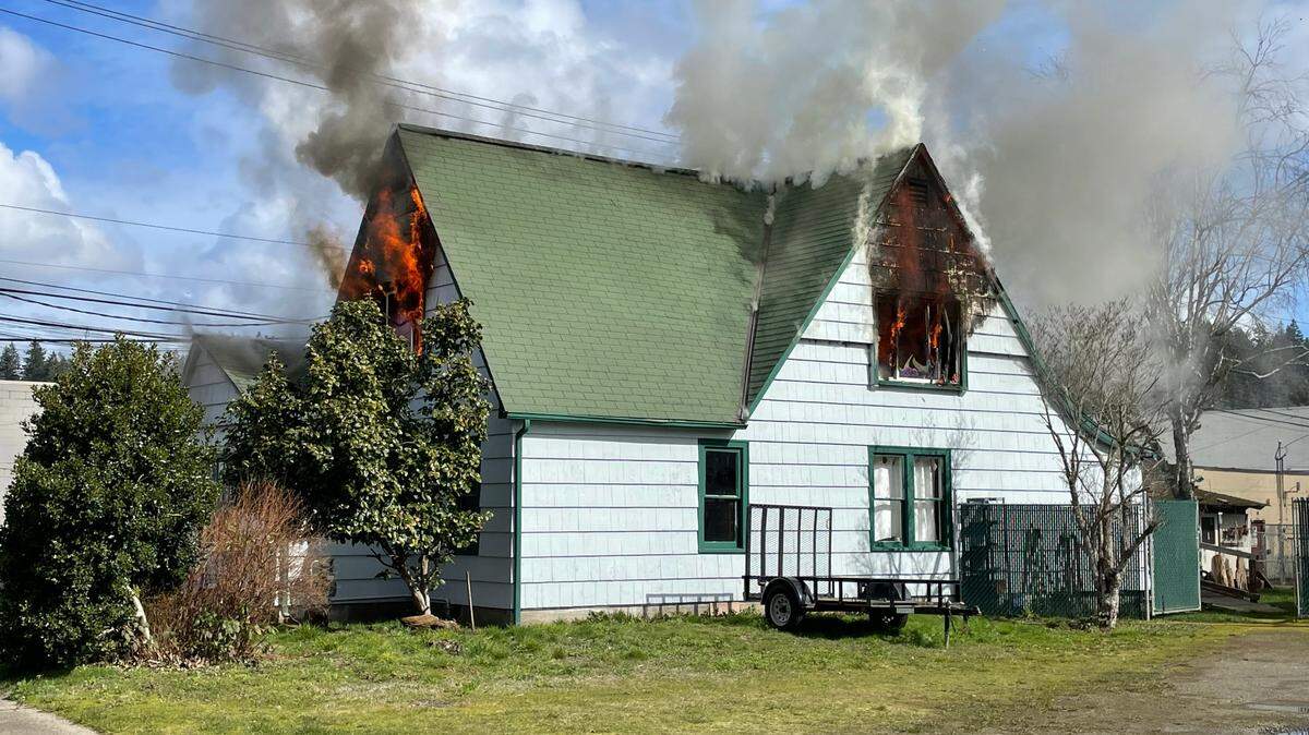 Fire crews in Mason County responded to a fire in a large house in downtown Shelton on Tuesday, March 14.
