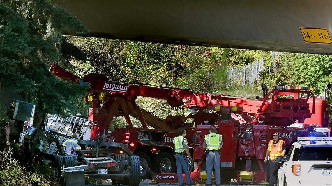 Log truck driver dies when semi leaves U.S. 101 onramp, lands on Deschutes Parkway