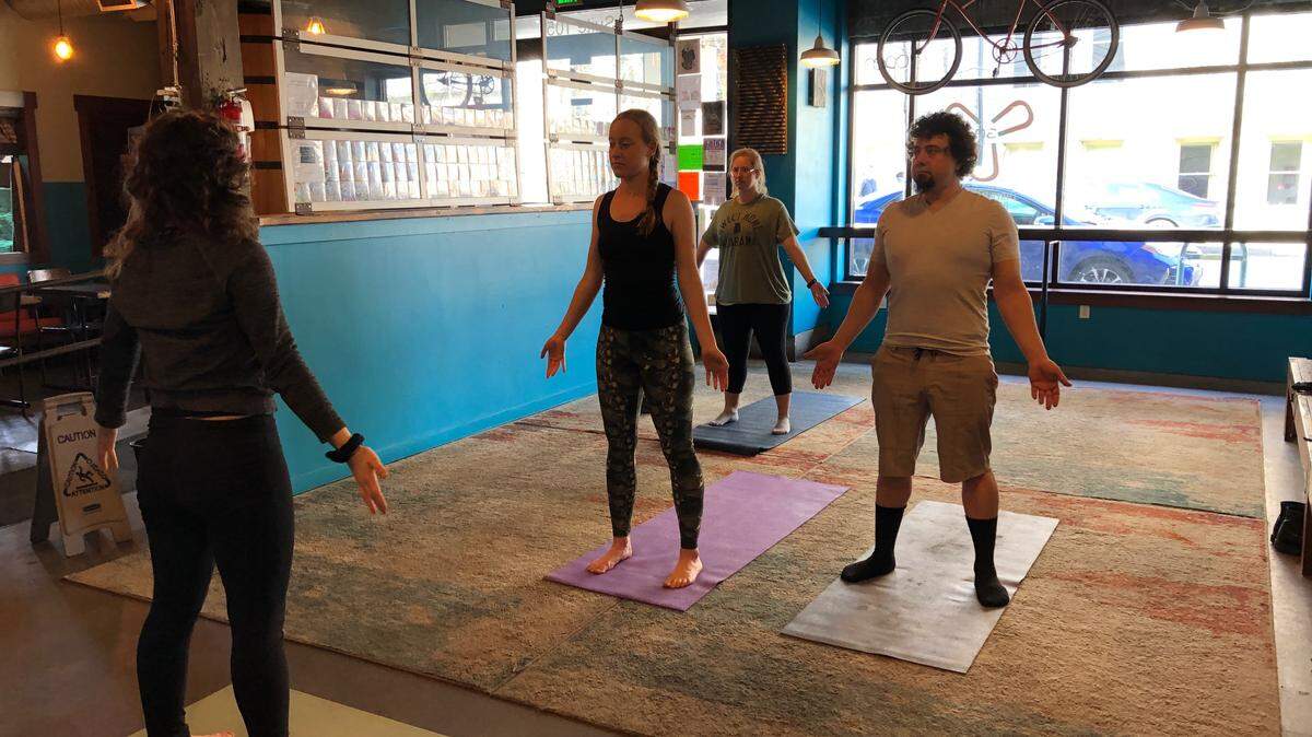 The Bend, Breathe & Beer Yoga classes happen Sundays in Three Magnets Brewing Co.’s barrel room.