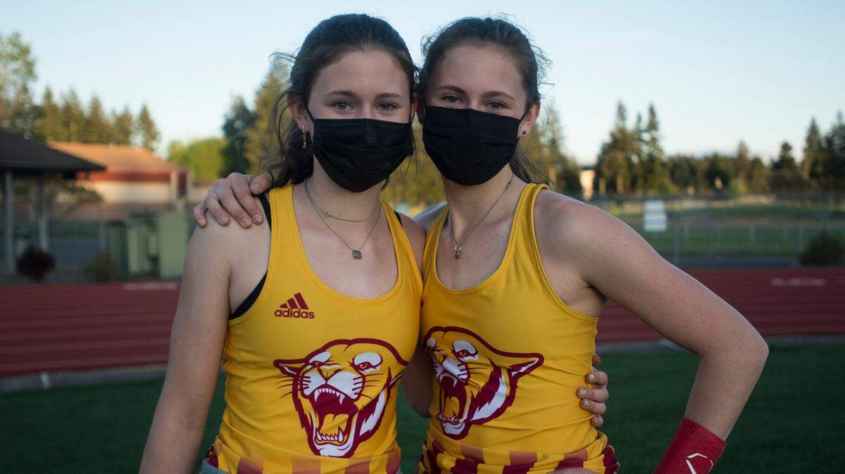 Capital High School sophomores Hana (left) and Amanda Moll shown at the Class 3A South Sound Conference championships on Friday, April 30, 2021 at South Sound Stadium in Lacey, Wash. The sisters finished first and second in the pole vault.