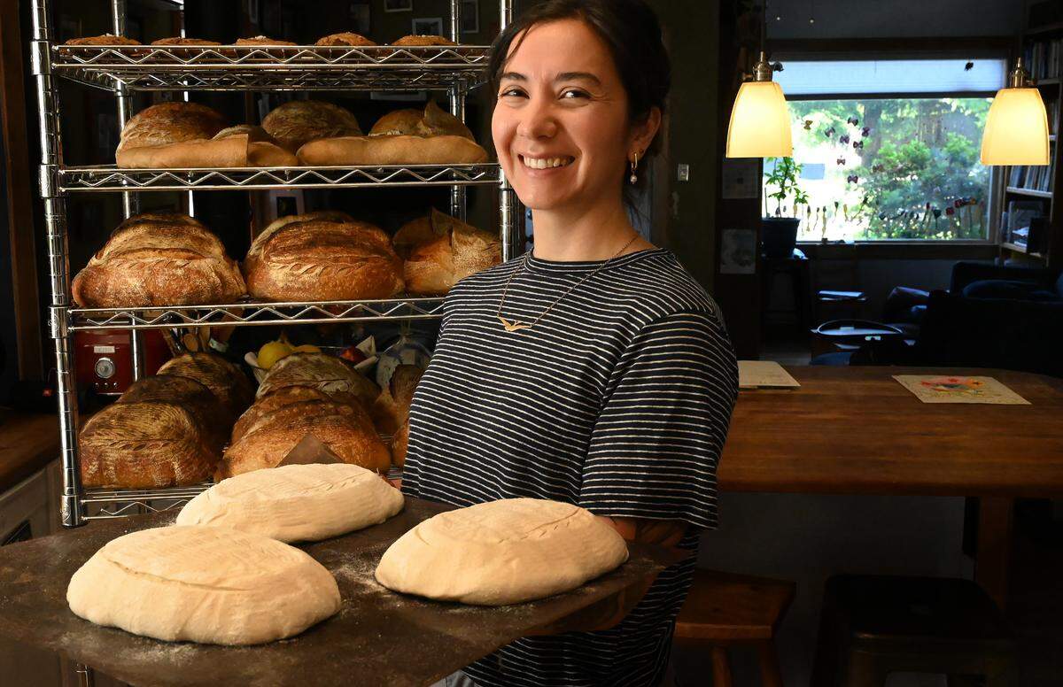 Working out of her west Olympia kitchen Meg Chernoff prepares a run of naturally leavened bread featuring regionally sourced ingredients for her customers and for sale at local outlets.