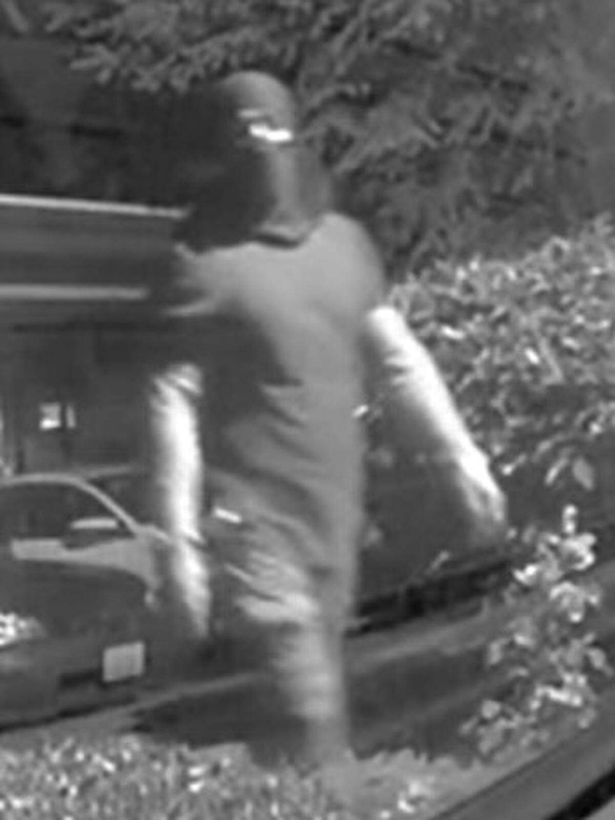 The suspect captured on video wearing a balaclava.