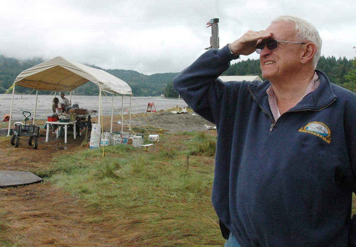 Mud Bay property owner Ralph Munro watches an eagle in flight as he stops by a Squaxin Island Tribe archaeological site on his property. Munro, a former Secretary of State, has died.