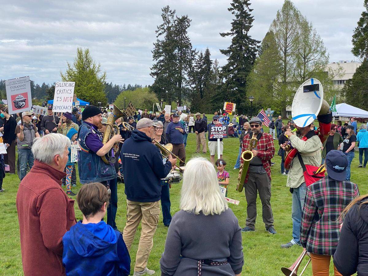 A small band of musicians got the crowd singing “We shall overcome” at one point on Saturday afternoon at the anti-Trump rally at the Capitol.