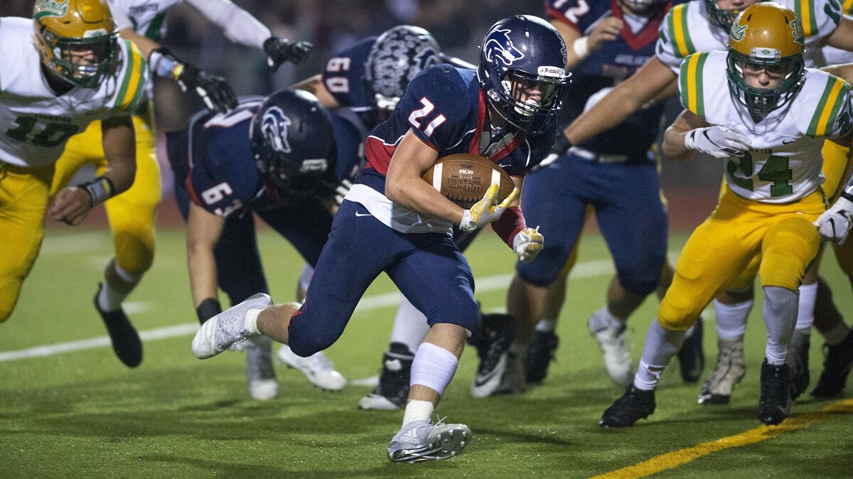 Black Hills running back Taylor Simmons slips into the end zone for a two-point conversion during Friday night’s Pioneer Bowl football game against the Tumwater T-Birds at Tumwater Stadium on Oct. 19, 2018.