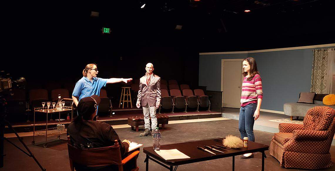 Olympia Little Theatre’s “The Bold, the Young, and the Murdered” is a farcical mystery that takes place on the set of a long-running soap opera. The cast includes, facing camera from left, Silva Goetz, Tom Sanders and Stephani Harness and, in the director’s chair, Johanna Chhay.