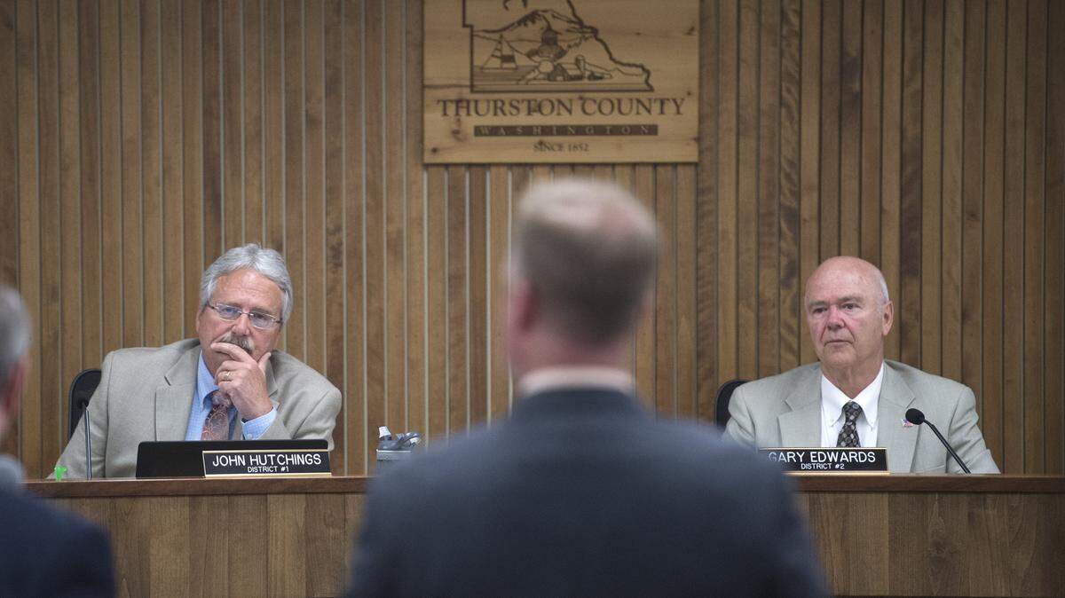 Thurston County Commissioners John Hutchings, left, and Gary Edwards during a 2017 board meeting.
