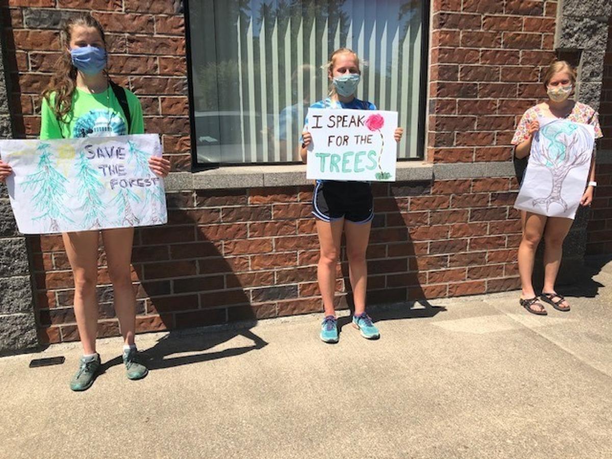 Students in Capital High School’s Climate Club demonstrate outside the office of Kidder Matthews, the real estate firm that brokered a lease deal between the Port of Olympia and Panattoni Development.