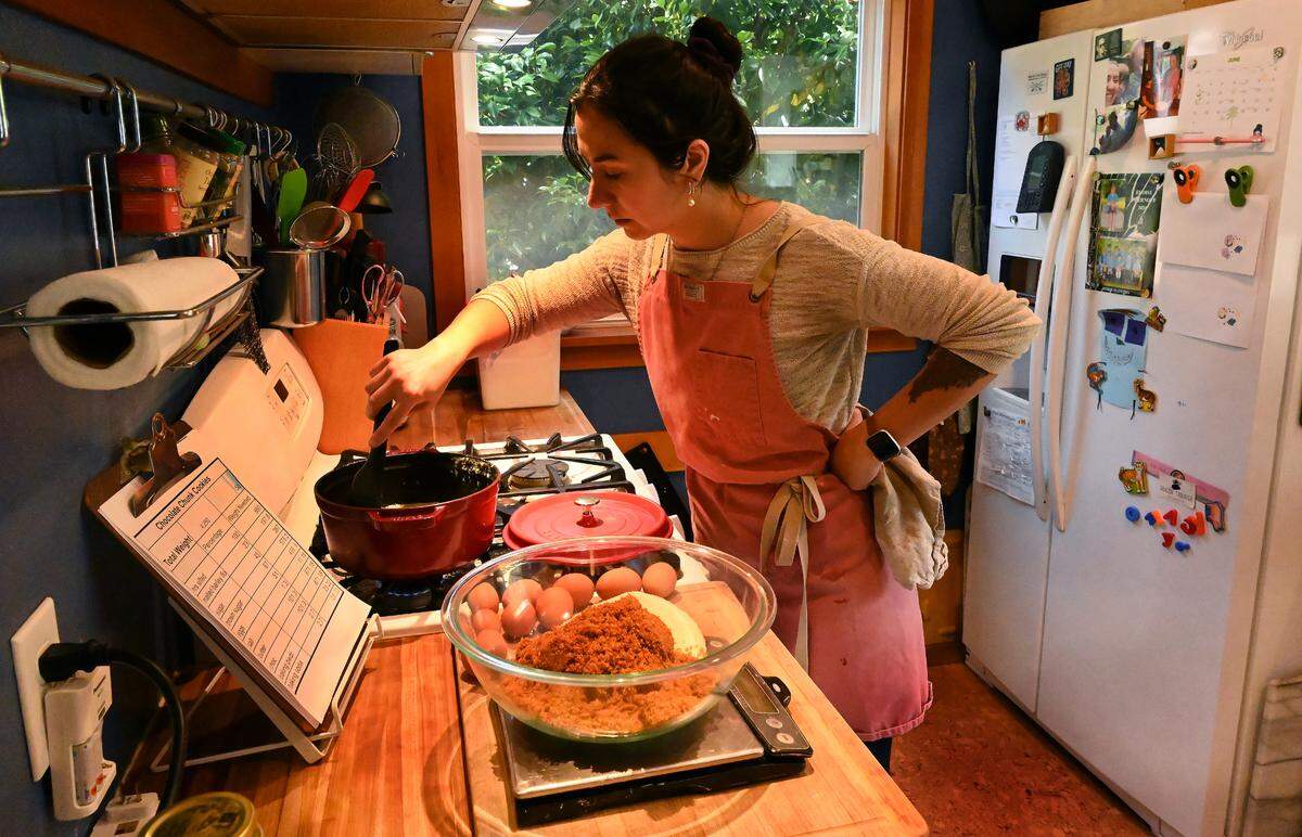 Working out of her west Olympia kitchen Meg Chernoff prepares a run of naturally leavened bread featuring regionally sourced ingredients for her customers and for sale at local outlets.