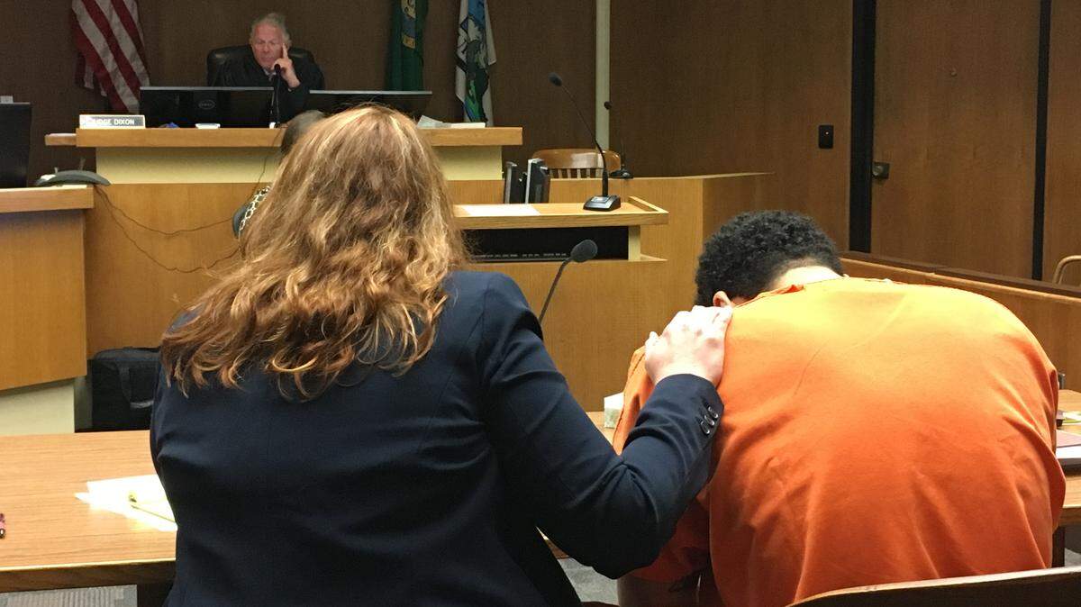 Defense attorney Kelly Seago comforts an emotional Ricardo Gardin-Gonzalez as he listens to Thurston County Superior Court Judge Jim Dixon on Wednesday.