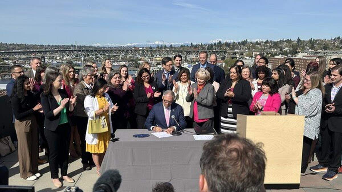 Gov. Jay Inslee signed five reproductive and gender-affirming healthcare bills into law at the University of Washington on Thursday April 27, 2023. The bills will offer more protection for those in the state who seek reproductive and gender-affirming healthcare