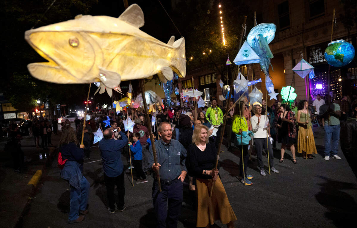 Handmade wildlife and nature luminaries light up the streets of downtown Olympia, Washington, for the Fall Arts Walk Luminary Procession on Friday, Oct. 7, 2022.