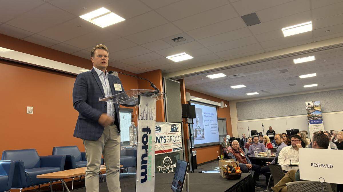 Coldwell Banker Evergreen Olympic Realty owner Mitch Dietz speaks during a Thurston Economic Development Council real estate forum on Sept. 25.