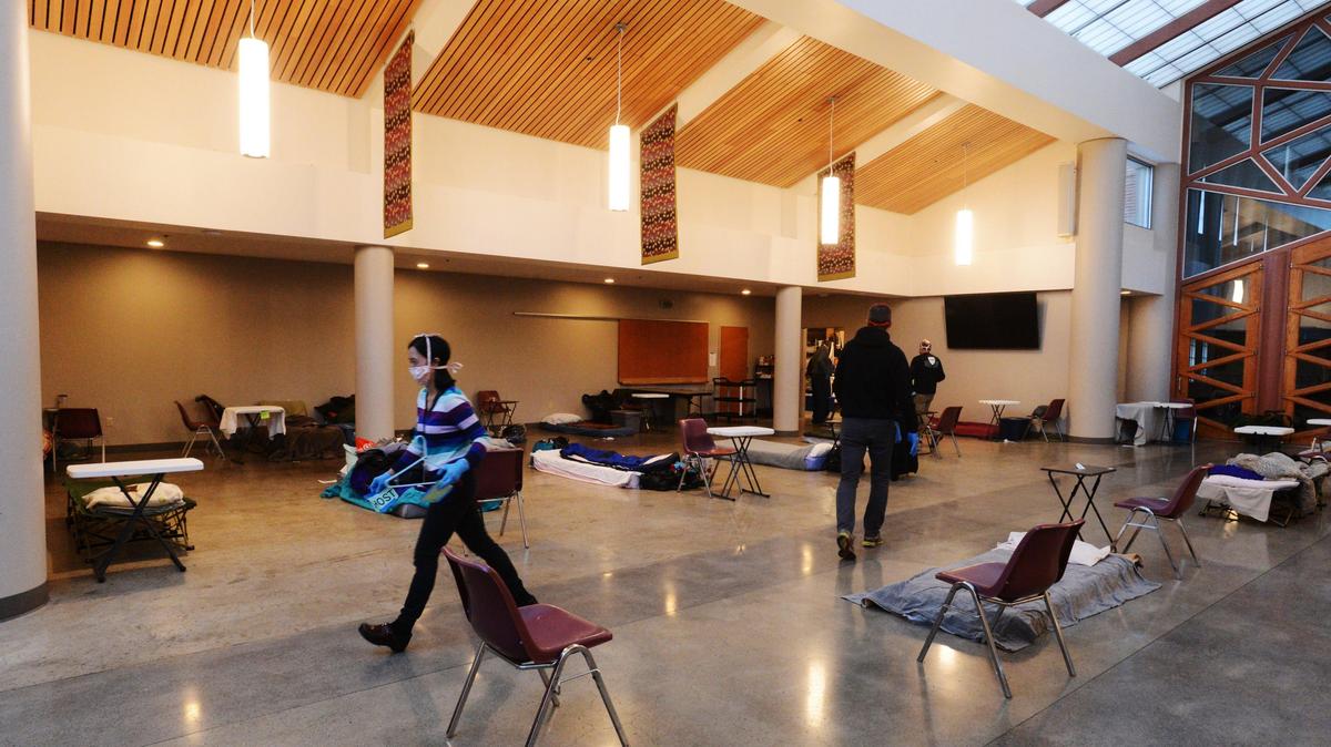 Kim Kondrat, a Steward for Community Outreach at St. Michael Parish, along with volunteers prepare to open the evening men’s shelter in 2020.