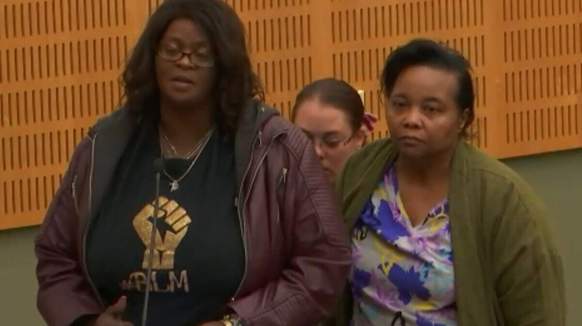 Talauna Reed, left, speaks on behalf of Millie Green, right, during the Olympia City Council meeting on Sept. 13. Millie is the mother of Timothy Green, a Black man who was shot and killed by police Aug. 22.