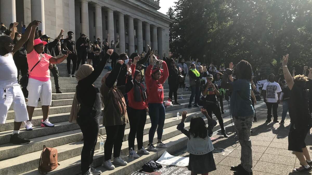 Tacoma rapper One Kahleo performs a song about police violence alongside his daughter.