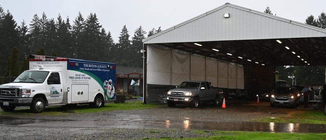 Cars line up at the drive-through mass testing site Thurston County Public Health and Social Services’ staff are running at the Thurston County Fairgrounds.